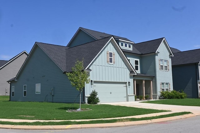view of front of home with a garage, board and batten siding, concrete driveway, and a front yard