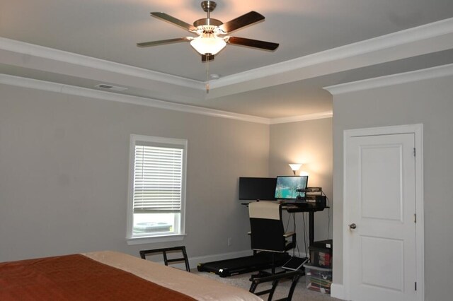 carpeted bedroom featuring a raised ceiling, crown molding, baseboards, and visible vents