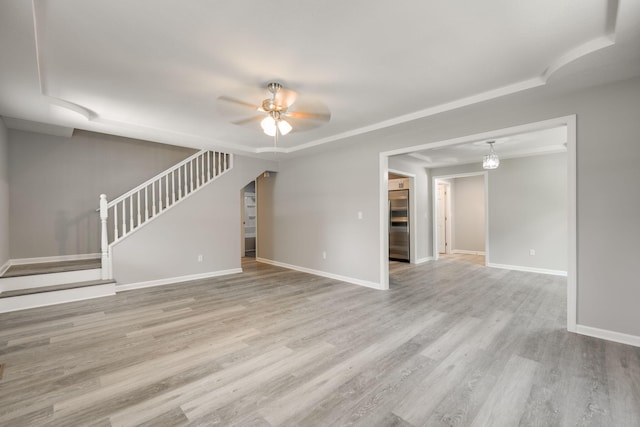 unfurnished living room with light wood-type flooring and ceiling fan