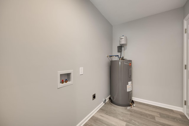 utility room featuring water heater