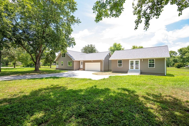 view of front facade featuring a garage and a front lawn