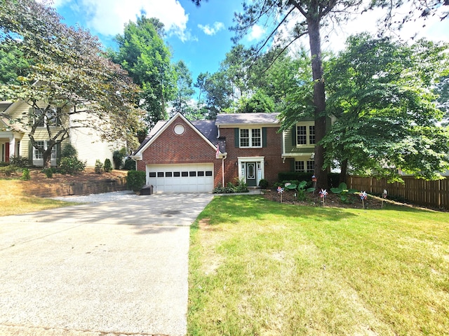 view of front of home with a garage and a front yard