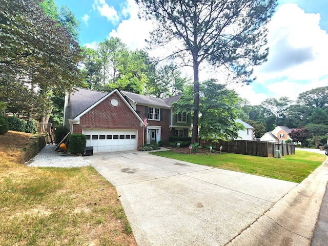 view of front of house featuring a garage and a front lawn