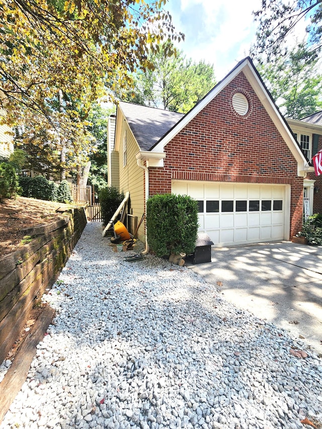 view of property exterior featuring a garage