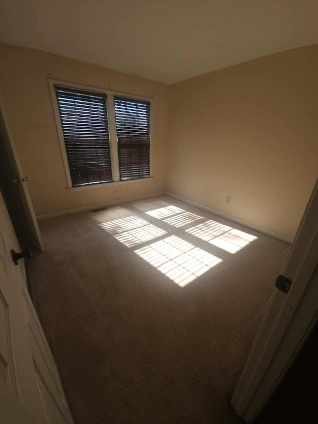 spare room with carpet flooring