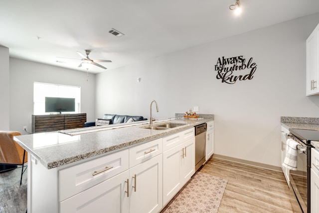 kitchen with kitchen peninsula, sink, ceiling fan, white cabinets, and light hardwood / wood-style floors