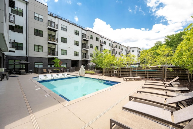 view of swimming pool with a patio area