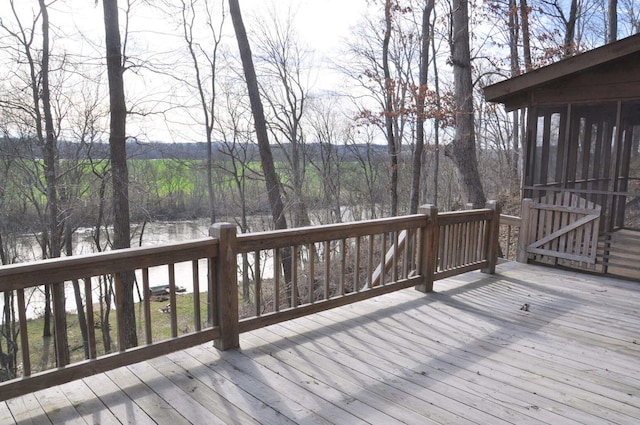 wooden deck with a water view