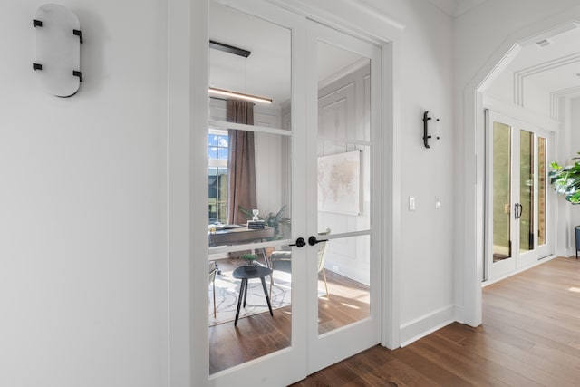 doorway featuring french doors and hardwood / wood-style flooring