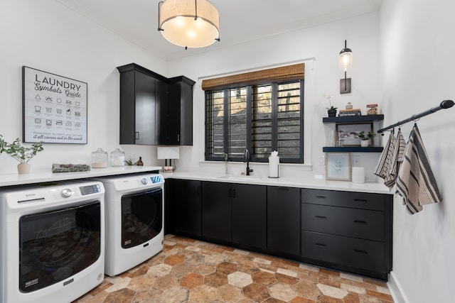 laundry room with independent washer and dryer, ornamental molding, cabinets, and sink