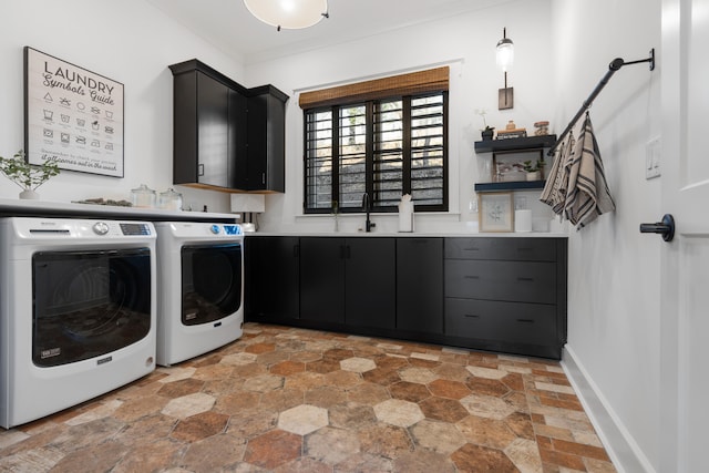 laundry room with washing machine and clothes dryer, cabinets, ornamental molding, and sink