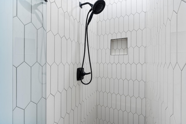 details with a tile shower