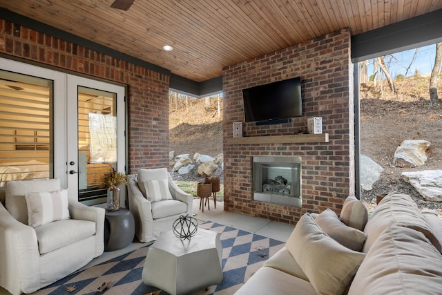 view of patio featuring an outdoor living space with a fireplace