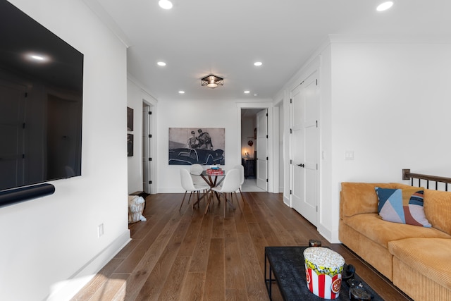 living room with ornamental molding and hardwood / wood-style flooring