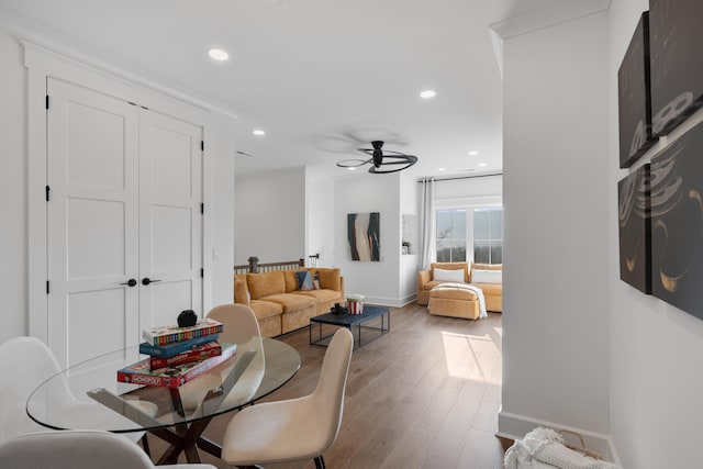 living room with ceiling fan and hardwood / wood-style floors