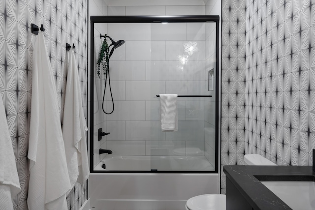 full bathroom with vanity, toilet, and shower / bath combo with shower curtain