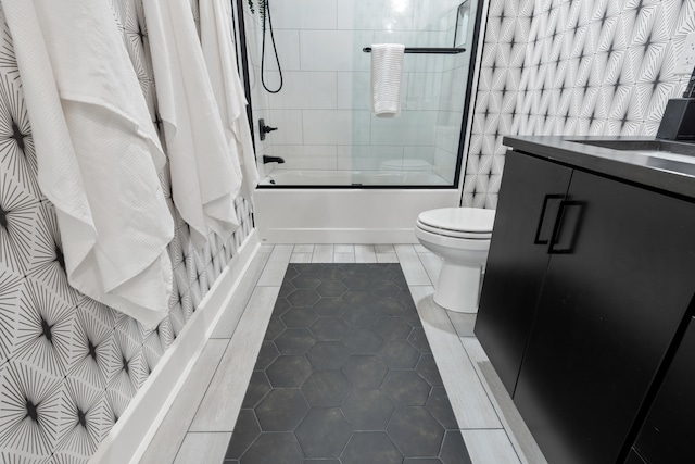 full bathroom with tile patterned flooring, vanity, toilet, and shower / bathtub combination with curtain