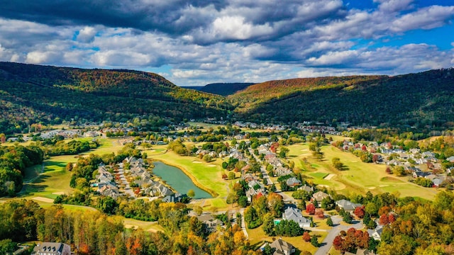 drone / aerial view with a water and mountain view