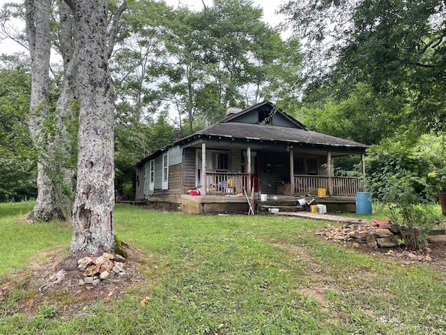 view of front of house featuring a front yard and covered porch