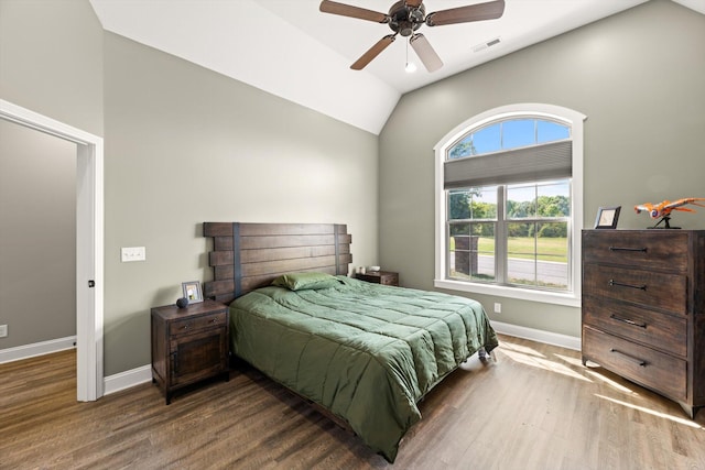 bedroom featuring lofted ceiling, ceiling fan, and dark hardwood / wood-style flooring