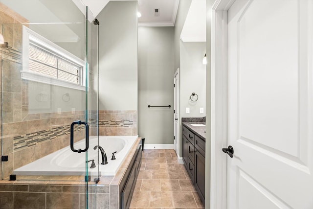 full bathroom featuring vanity, crown molding, baseboards, a shower stall, and a garden tub