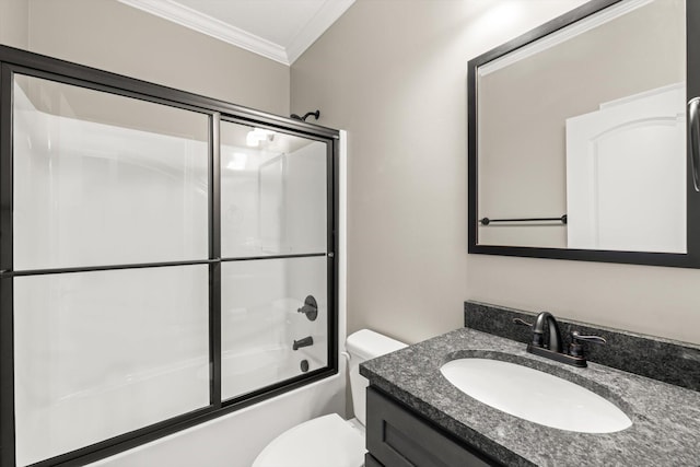 full bathroom featuring vanity, toilet, ornamental molding, and bath / shower combo with glass door