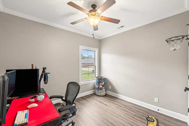 home office with ceiling fan, ornamental molding, and wood-type flooring