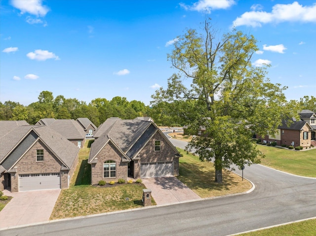 view of front facade featuring a front lawn, driveway, brick siding, and roof with shingles