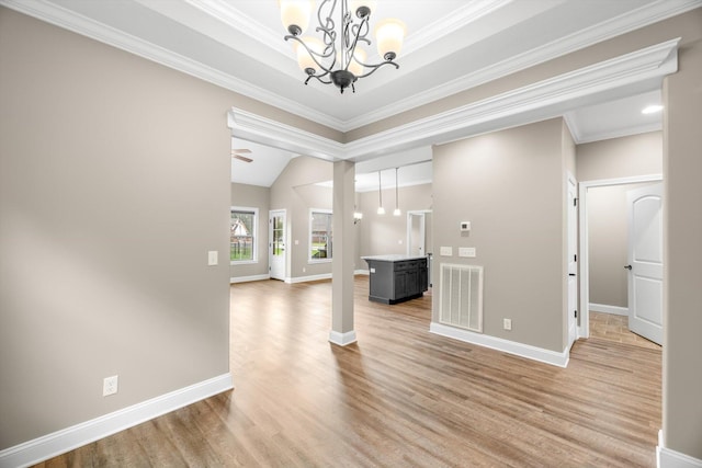 entrance foyer with a notable chandelier, baseboards, light wood-style floors, and visible vents