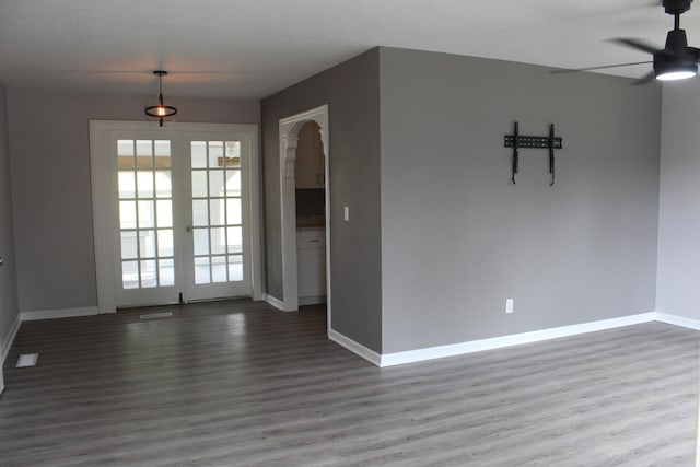 spare room with a textured ceiling, ceiling fan, and hardwood / wood-style flooring