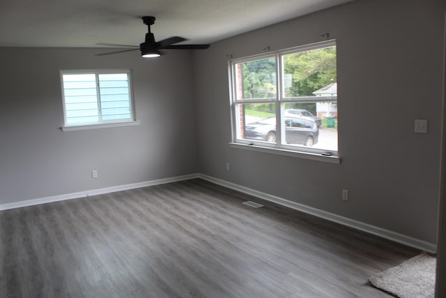 empty room with ceiling fan and wood-type flooring