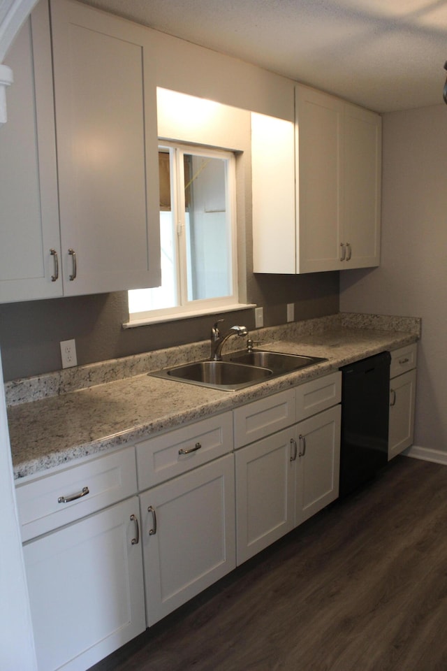 kitchen with white cabinets, dishwasher, dark hardwood / wood-style floors, and sink