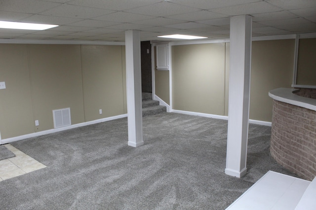 basement with carpet and a drop ceiling