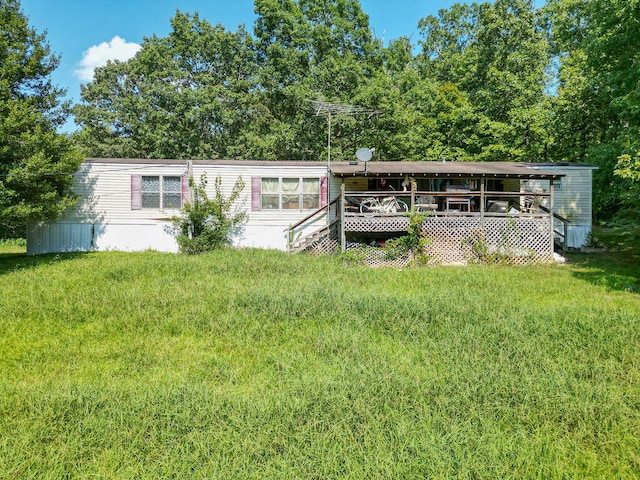 rear view of property with a yard