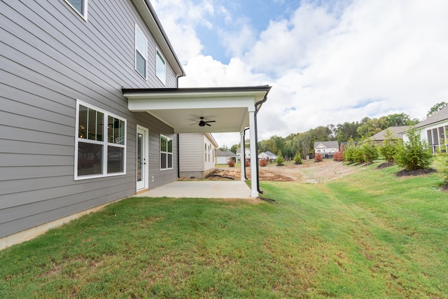 view of yard featuring ceiling fan and a patio area