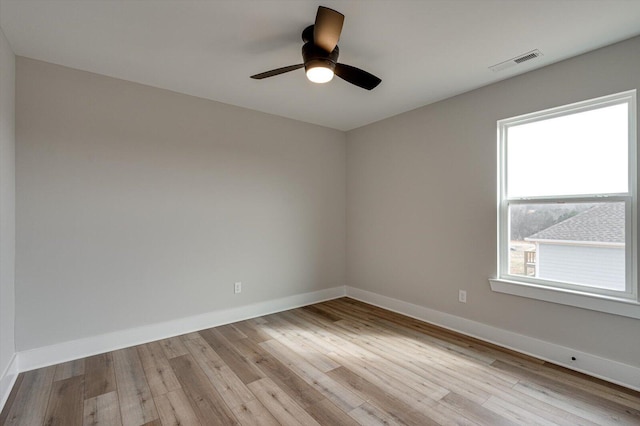 spare room featuring ceiling fan and light wood-type flooring