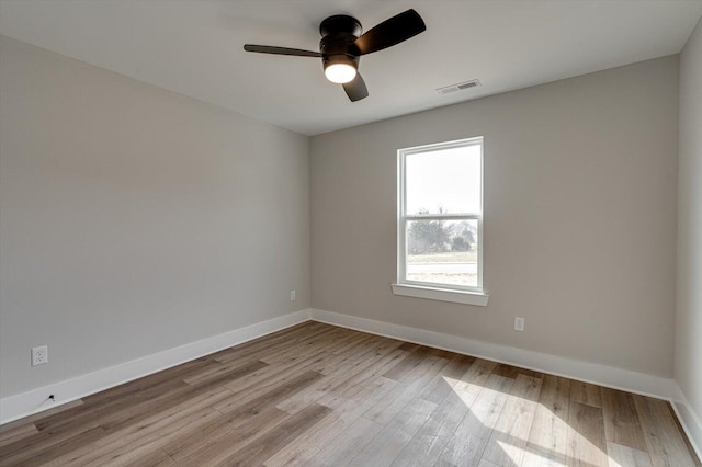 spare room featuring ceiling fan and light wood-type flooring