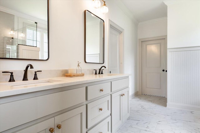 bathroom with vanity and ornamental molding