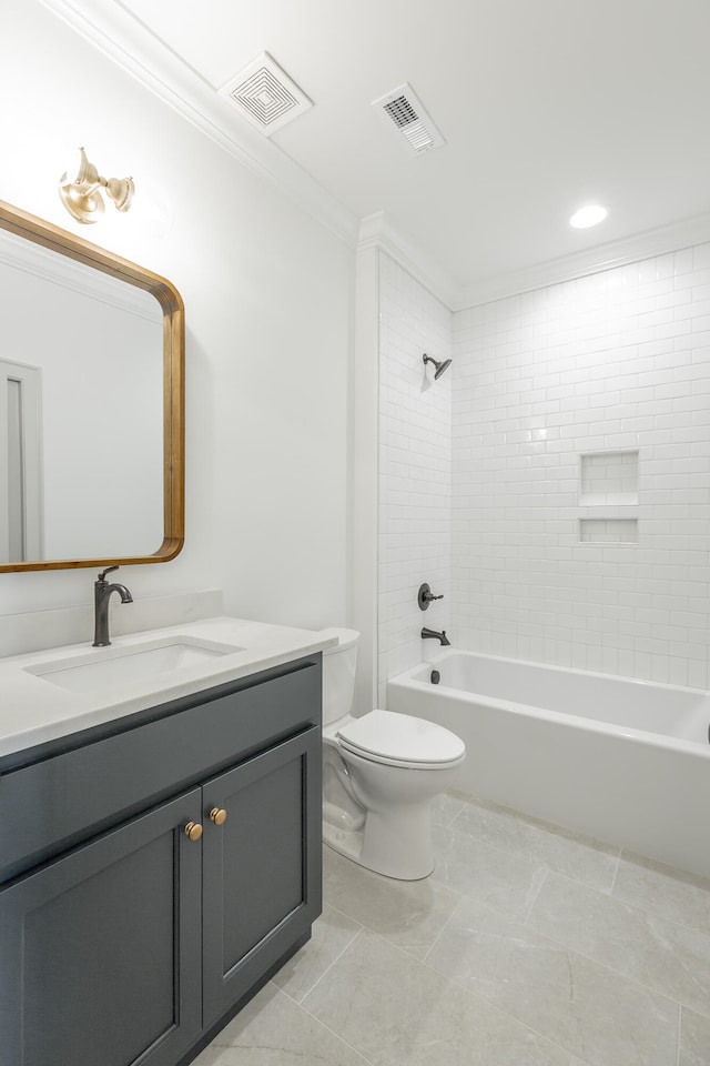 full bathroom featuring tiled shower / bath combo, vanity, toilet, and crown molding