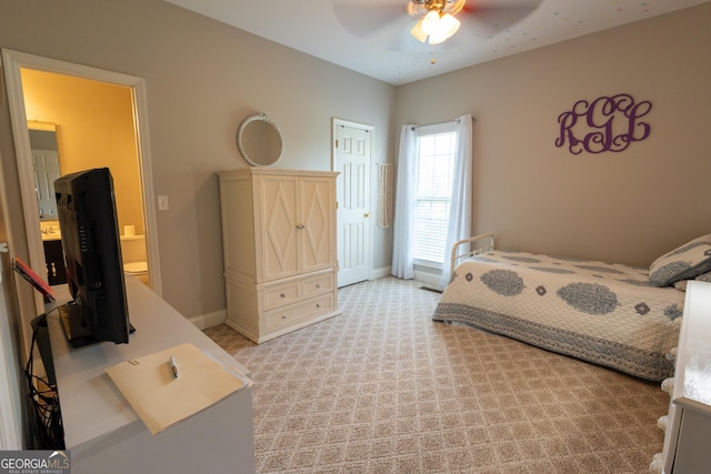 carpeted bedroom with ceiling fan and a closet