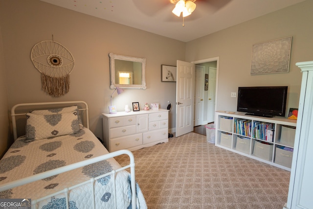 bedroom featuring light colored carpet and ceiling fan