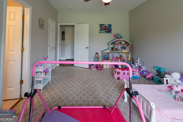 playroom with ceiling fan and light carpet