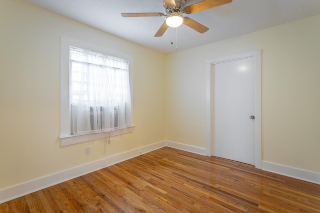 spare room with ceiling fan and hardwood / wood-style floors