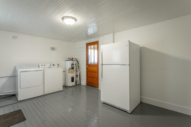 laundry area with hardwood / wood-style floors, washer and clothes dryer, and electric water heater