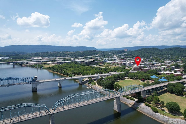 bird's eye view with a water and mountain view