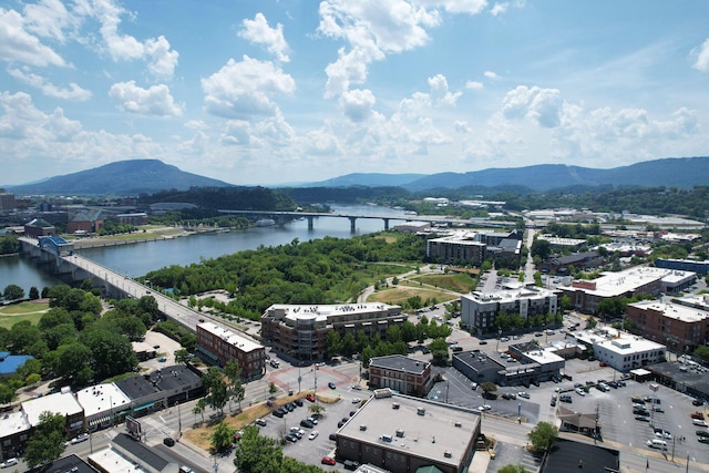 birds eye view of property featuring a water and mountain view