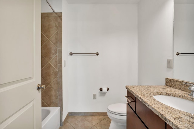 full bathroom featuring tile patterned flooring, vanity, tiled shower / bath combo, and toilet