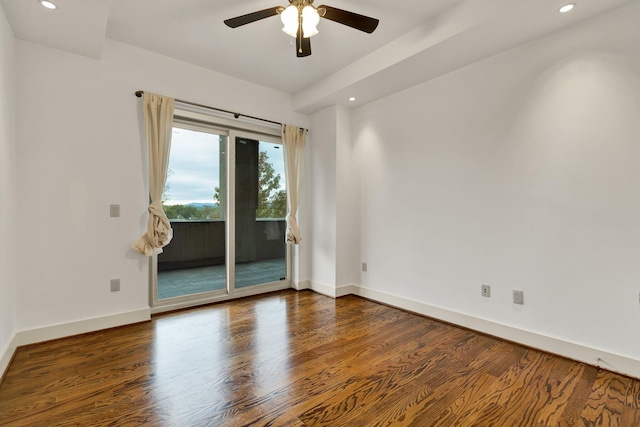 unfurnished room with ceiling fan and dark hardwood / wood-style floors