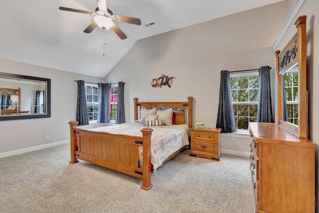 carpeted bedroom with vaulted ceiling and ceiling fan