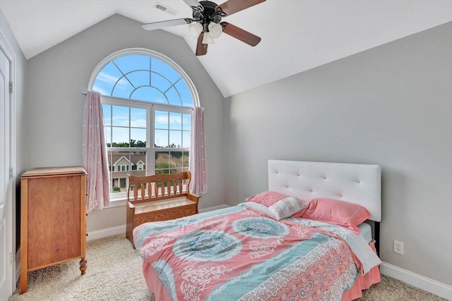 bedroom featuring ceiling fan, light colored carpet, lofted ceiling, and multiple windows